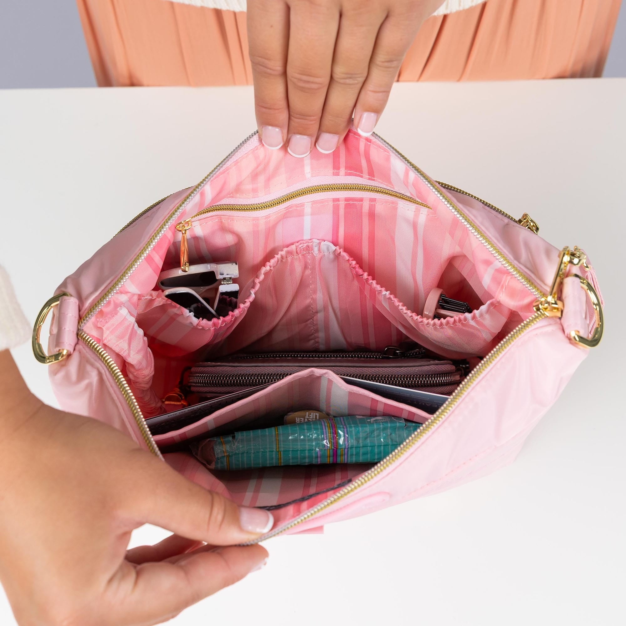 Flare 2 Crossbody Bag with Puller - - 24772_Flare2wPuller_BubblePink_Lifestyle_01