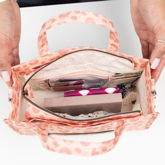 Train Top Handle Crossbody Bag - - 25796_Train_FadedLeopardPink_Lifestyle_02