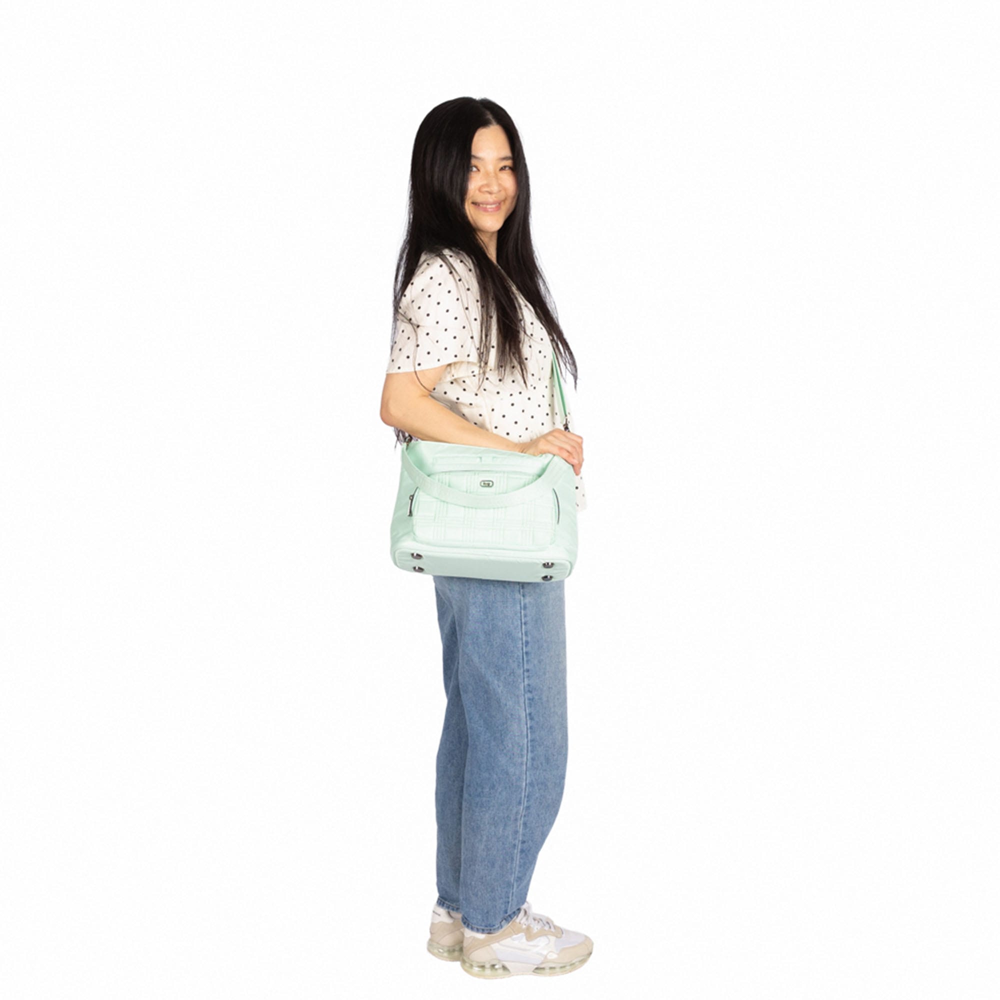 Lug Samba 2 convertible crossbody bag in mist green with adjustable strap and sleek design, showing front view of the bag.