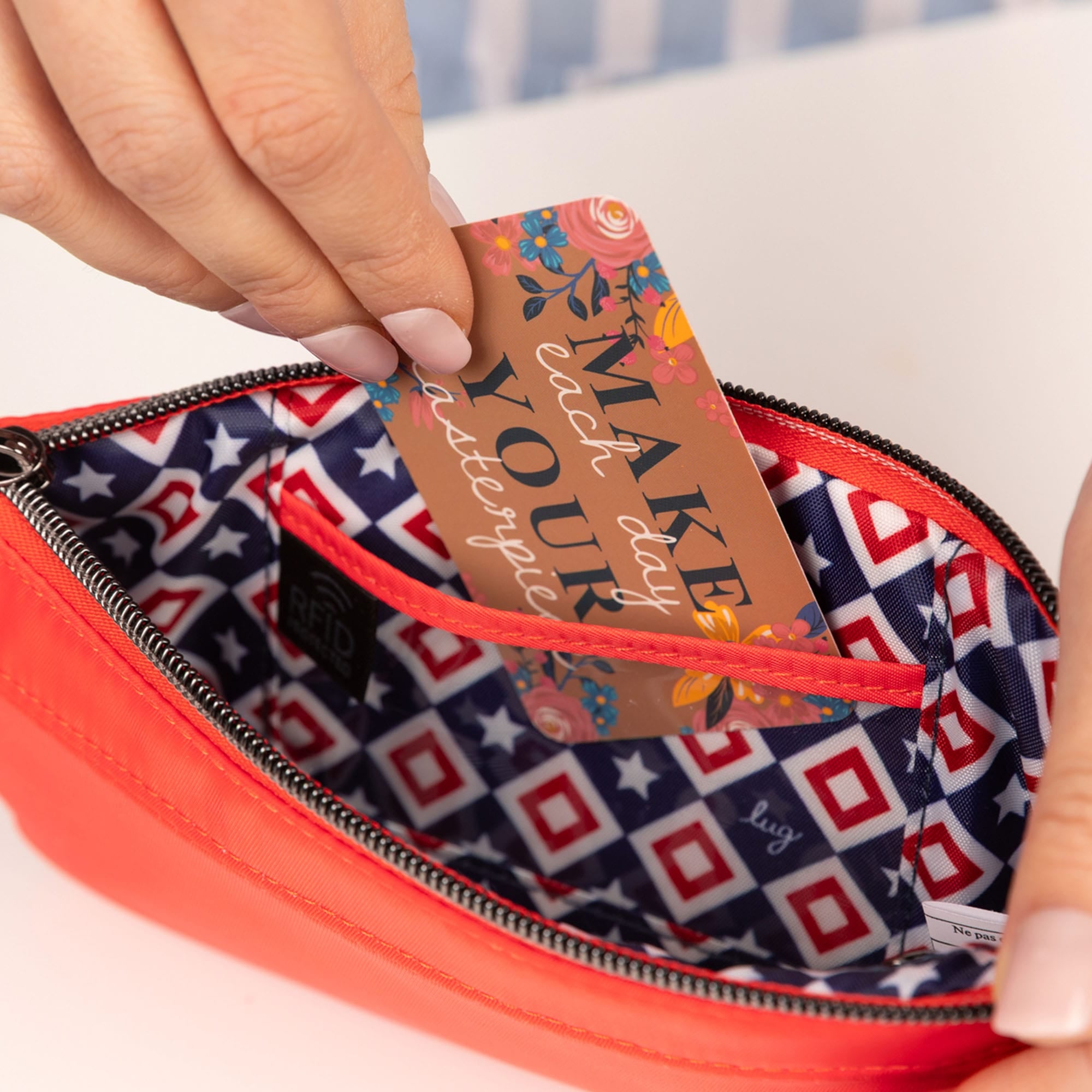 Super Metro XL Wristlet with Charm Bar - - 26262_SuperMetroXL_CayenneRed_Lifestyle_04