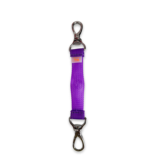 Purple Lug KultureCity x Toggle Sensory Toy keychain, a tactile accessory with textured toggle for sensory engagement.