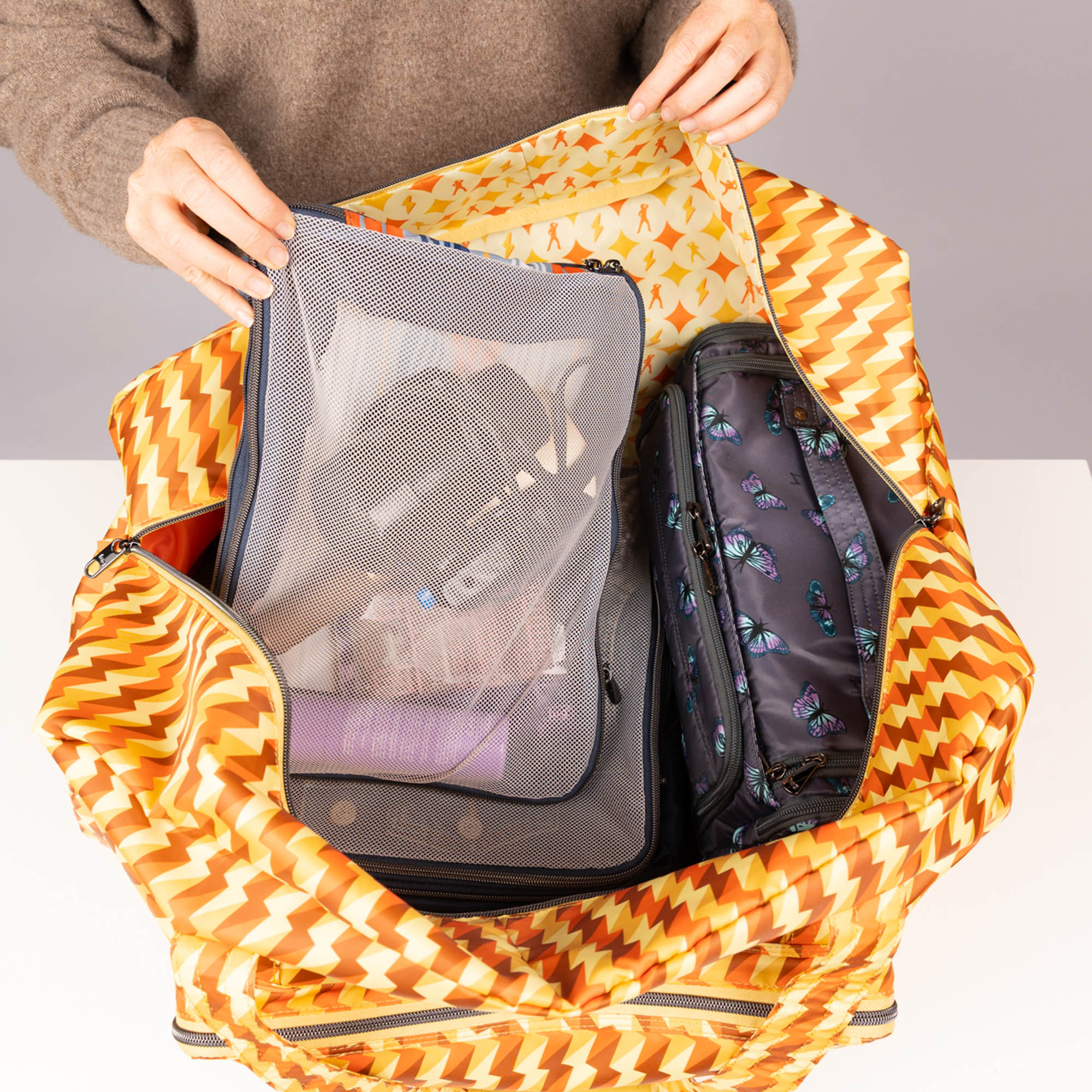 TWiNSAUCE x Lug Bossa Nova 2 Packable Duffel - - 26908_LUGxTWiNSAUCE_BossaNova2_BoltOrange_Lifestyle_02