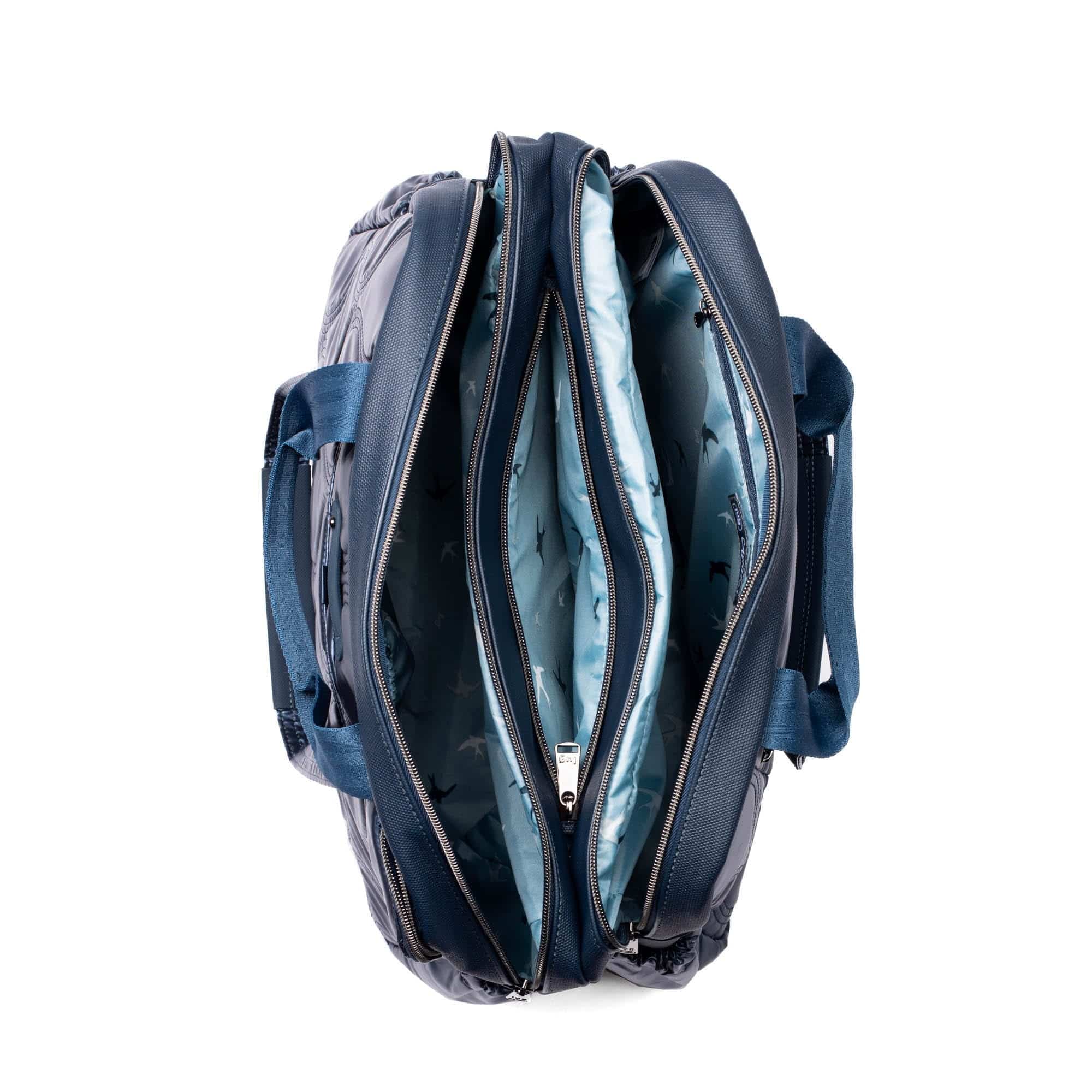 Lug Aviator Carry-All Tote Bag in metallic indigo color, featuring spacious design and sturdy handles for versatile carrying.