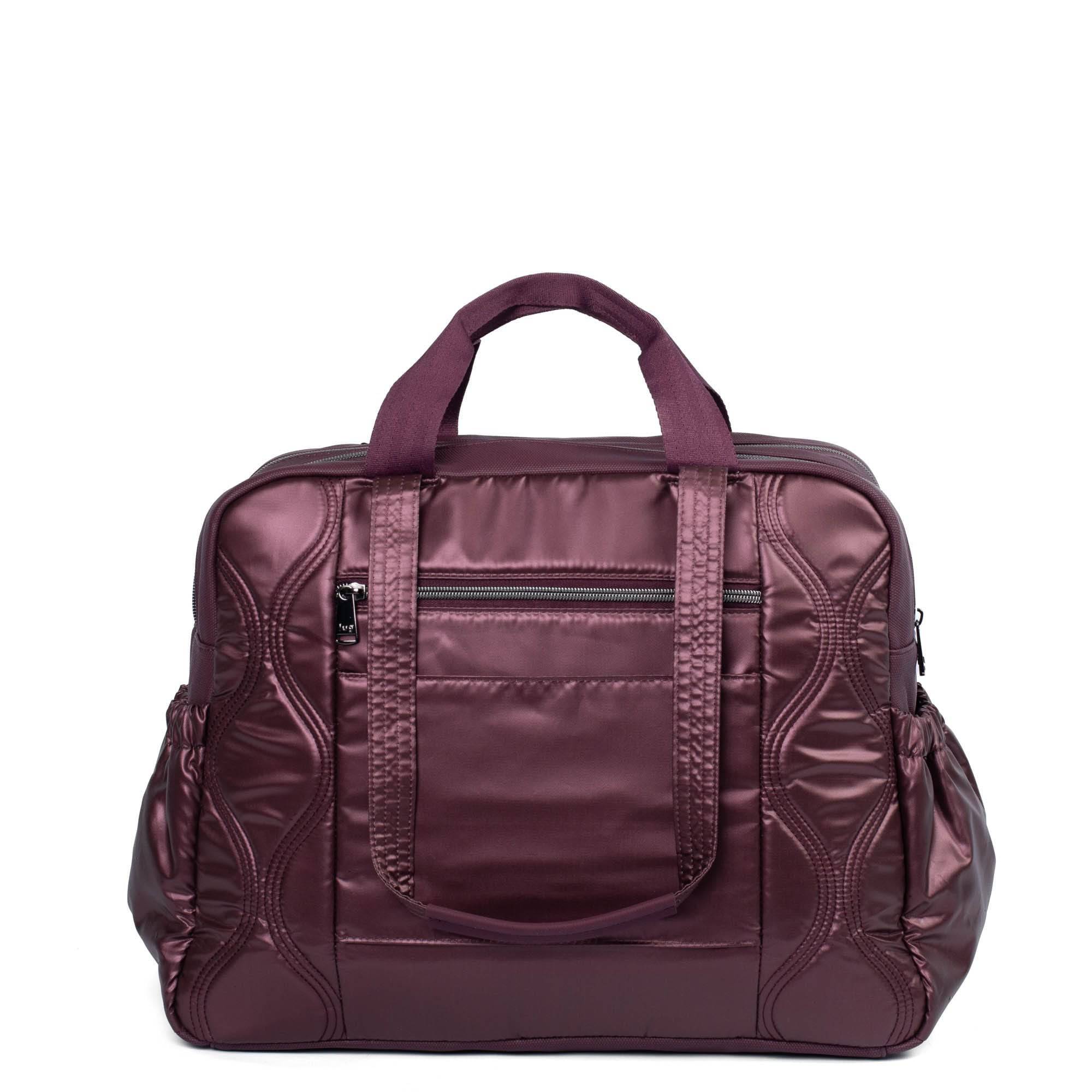 Lug Aviator Carry-All Tote Bag in metallic wine color with spacious interior and sturdy handles for daily use.