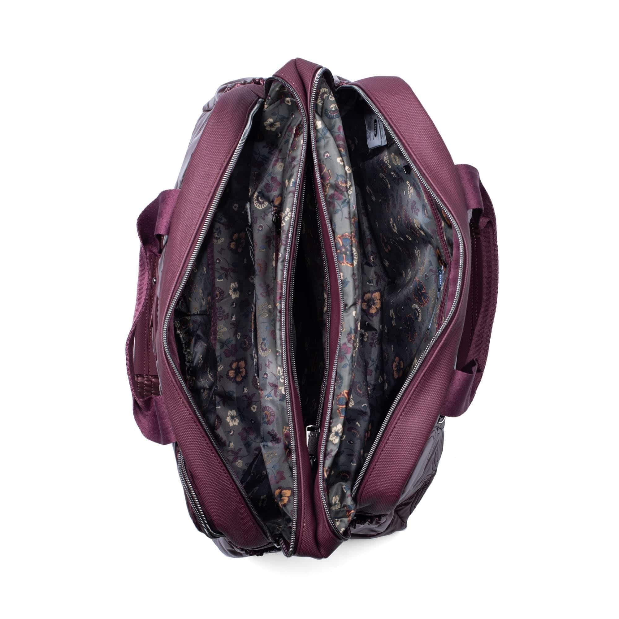 Lug Aviator metallic wine carry-all tote bag with dual handles and spacious interior for versatile everyday use.