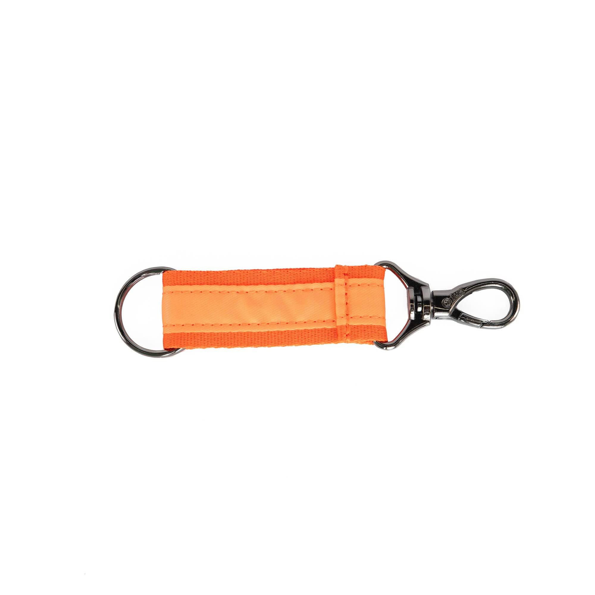 Lug coral link key chain accessory with a sleek, minimalist design, featuring a metal keyring and vibrant coral color.