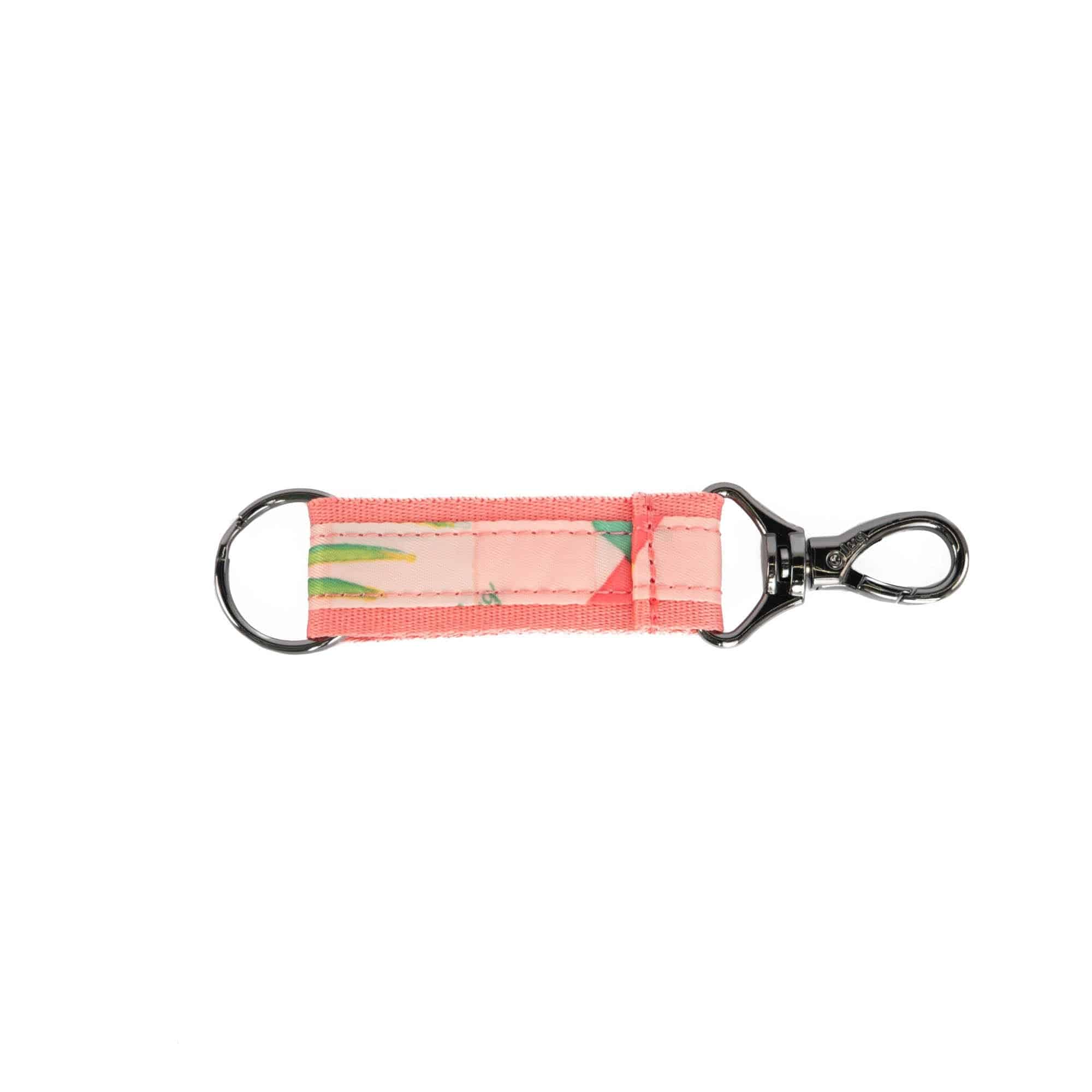 Pink popsicle-shaped key fob accessory by Lug, attached to a key chain with a colorful design.