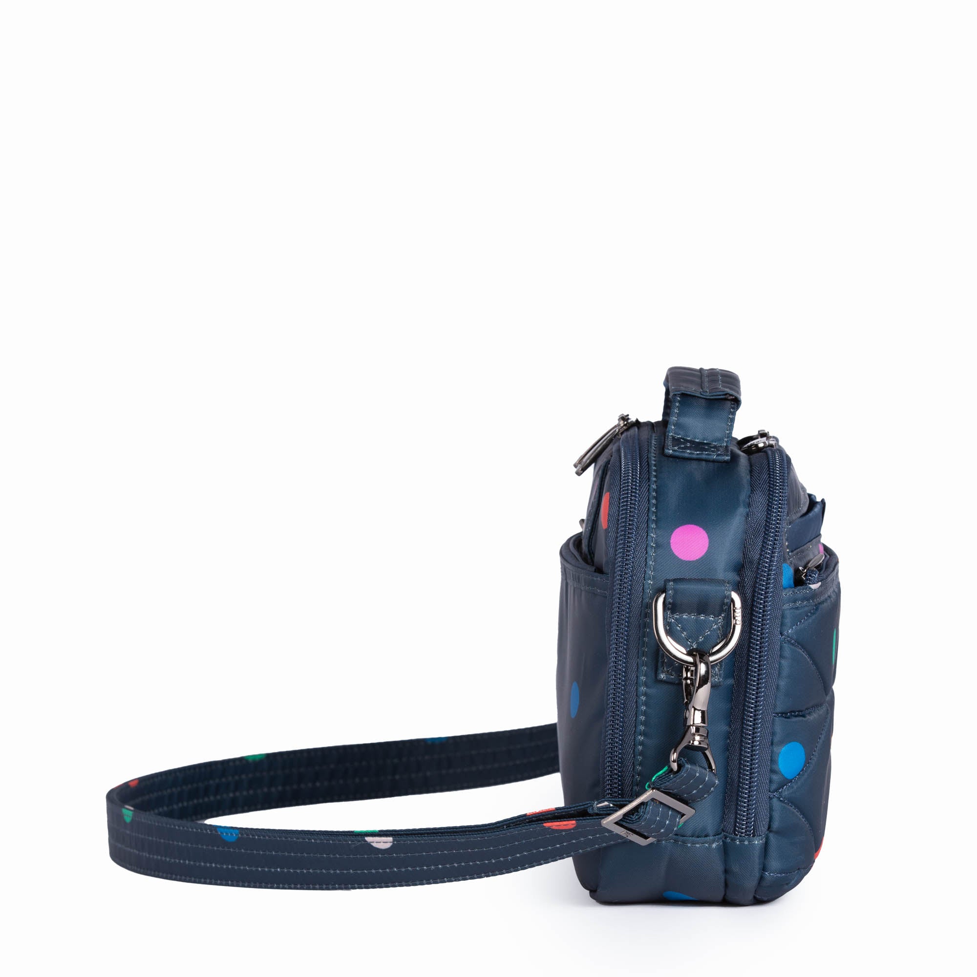 Lug Roundabout XL convertible wallet crossbody bag with multicolored dots, showing the adjustable strap and spacious design.