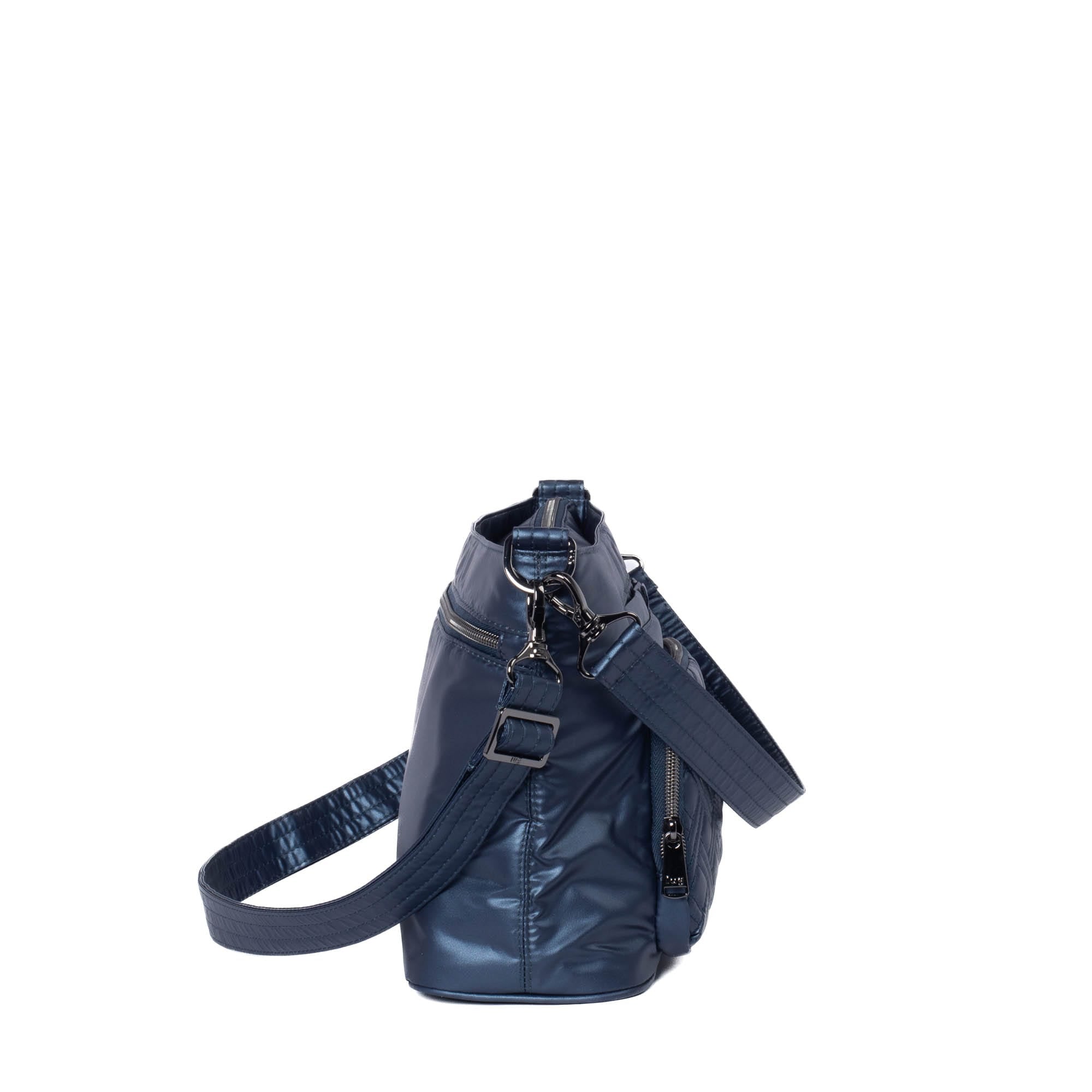 Lug Samba 2 convertible metallic indigo crossbody bag with adjustable strap and multiple compartments.