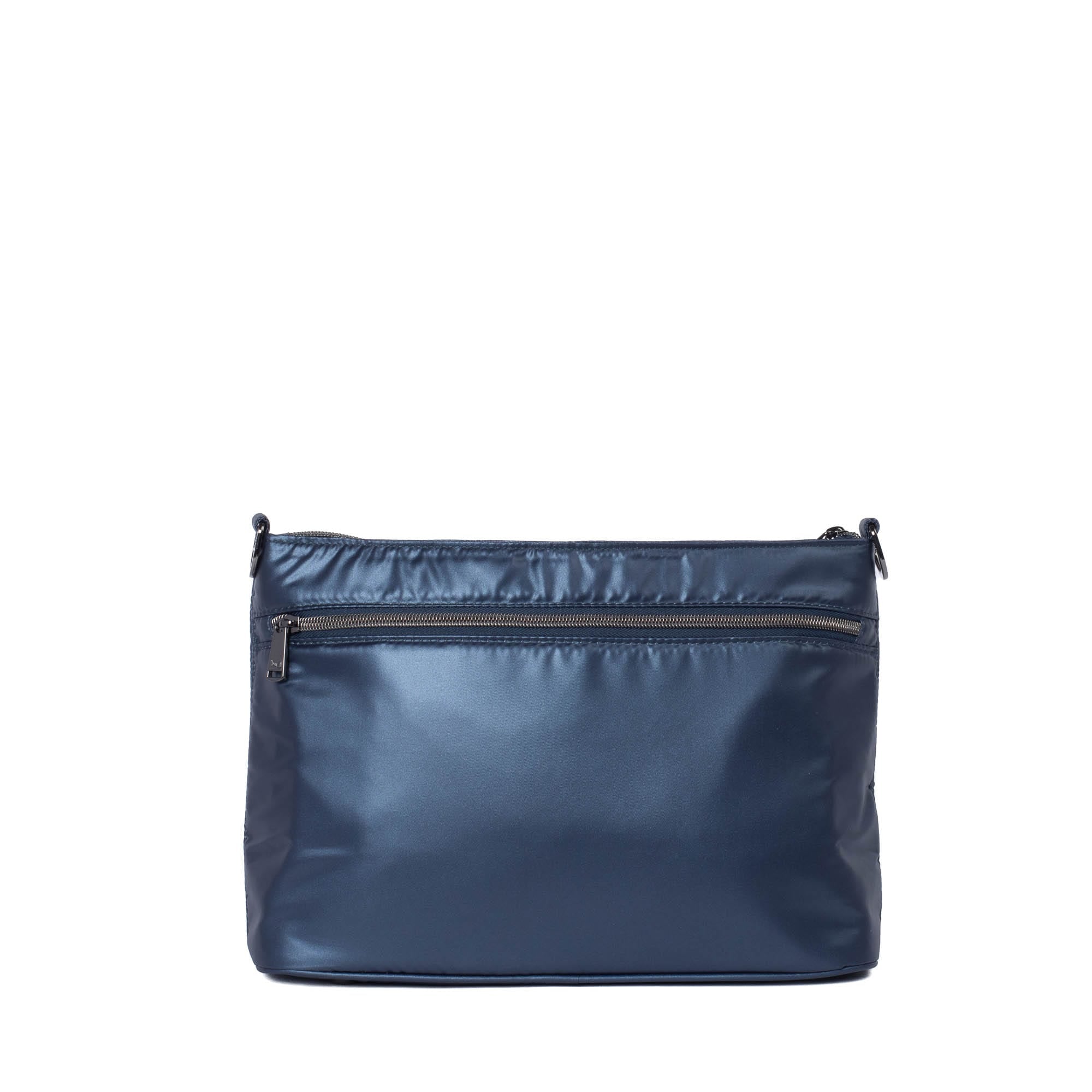 Lug Samba 2 convertible crossbody bag in metallic indigo with adjustable strap and front zip pocket.