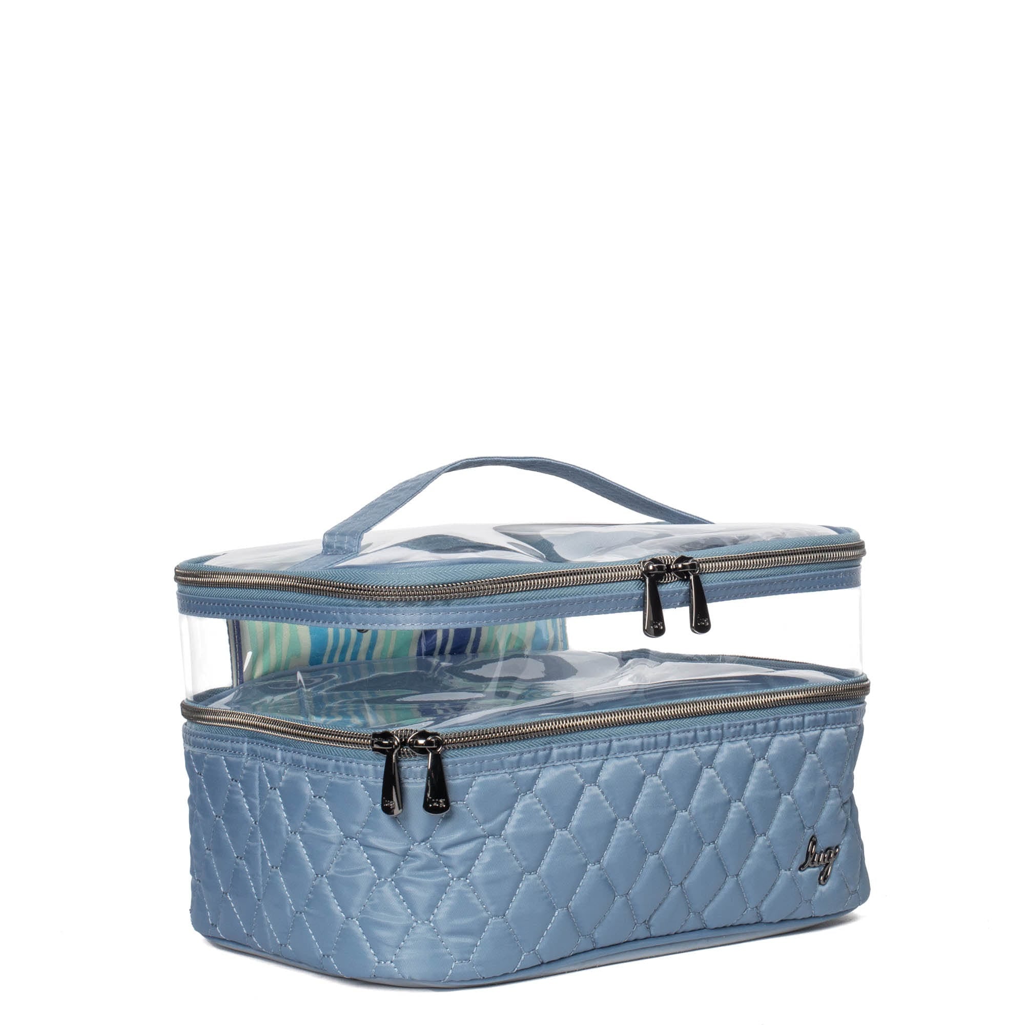 Blue Whoosh Clearview cosmetic case by Lug, showing a transparent zipper pouch with multiple compartments for makeup and beauty tools.