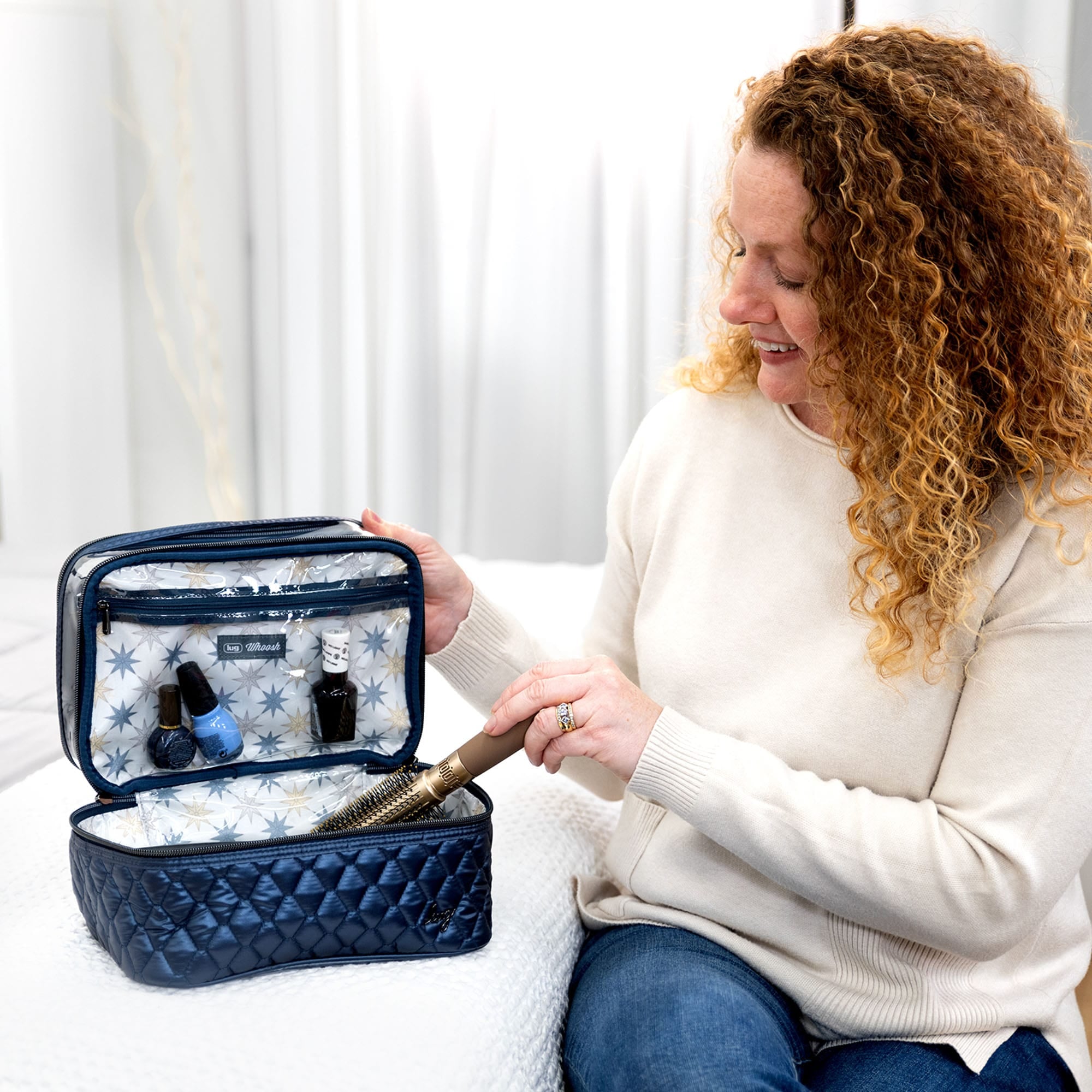 Lug Whoosh Clearview cosmetic case with transparent design, compact storage for makeup and beauty essentials.