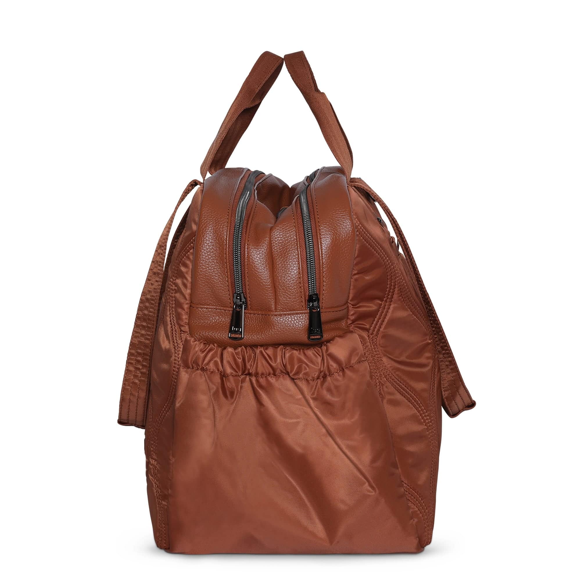 Copper brown Lug Aviator Carry-All Tote Bag with multiple compartments and durable straps, designed for versatile everyday use.