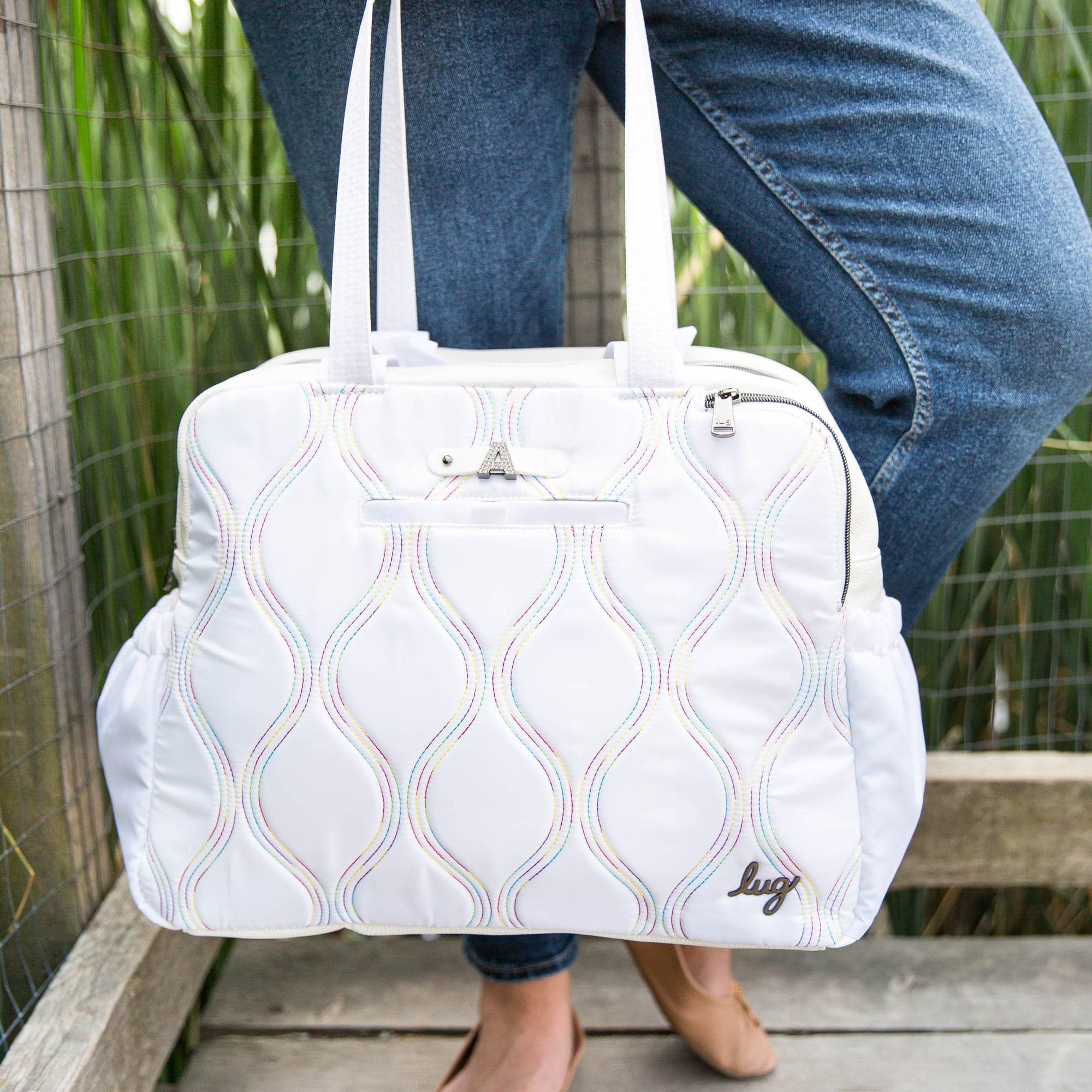 Lug Aviator Carry-All tote bag with multiple compartments, made of durable fabric, featuring a sleek design in neutral tones.