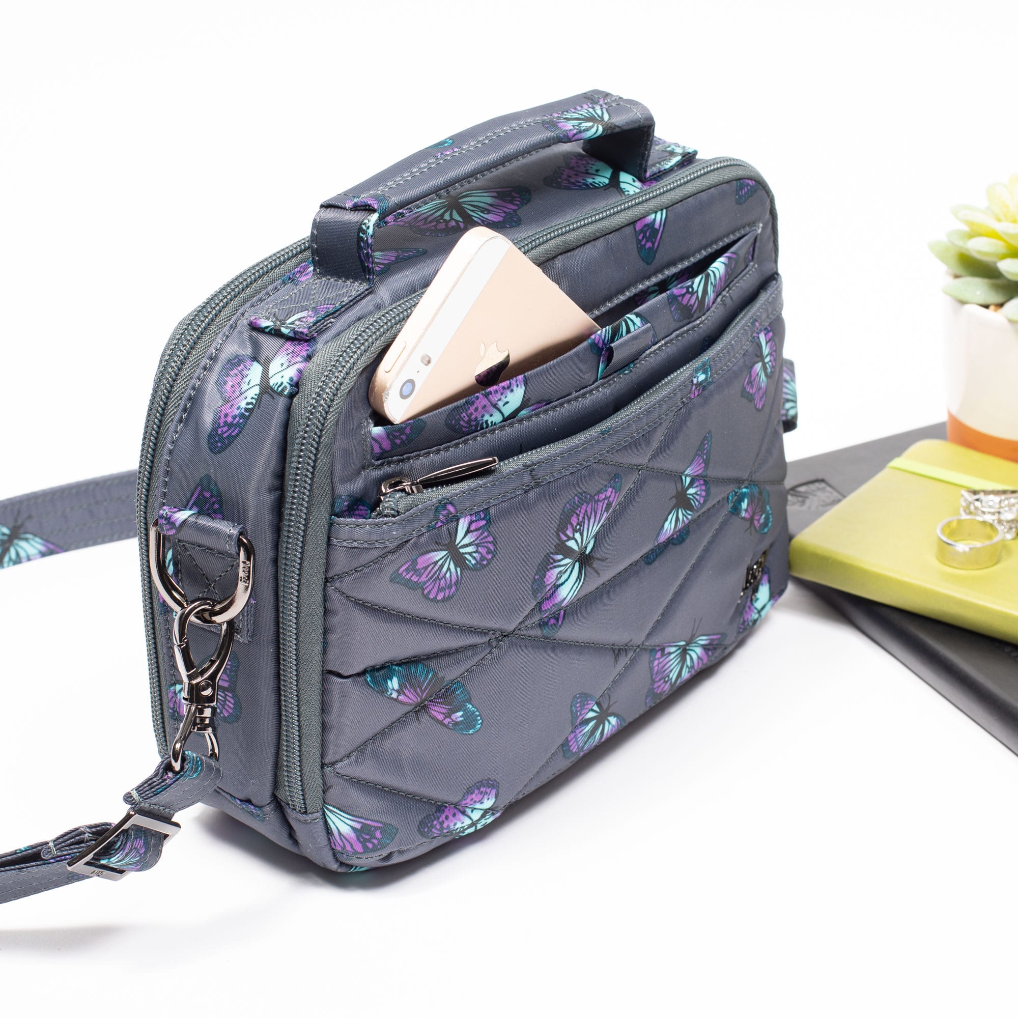 Lug Roundabout XL convertible wallet crossbody bag in black leather with adjustable strap and multiple compartments.