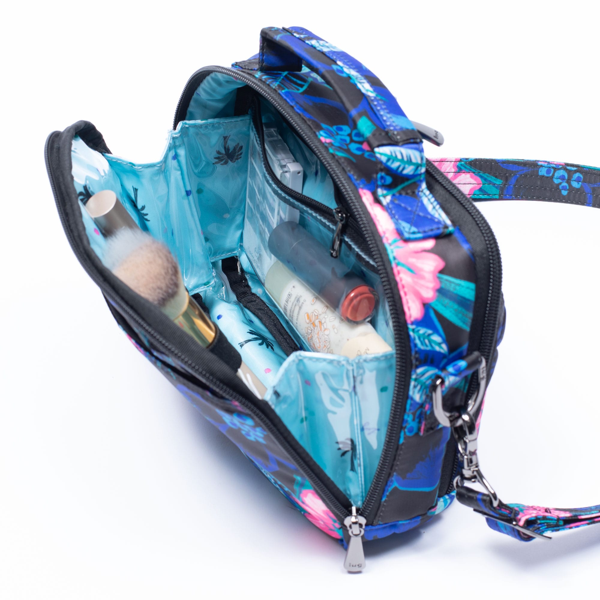 Lug Roundabout XL convertible wallet crossbody bag with adjustable strap and multiple compartments in a lifestyle setting.