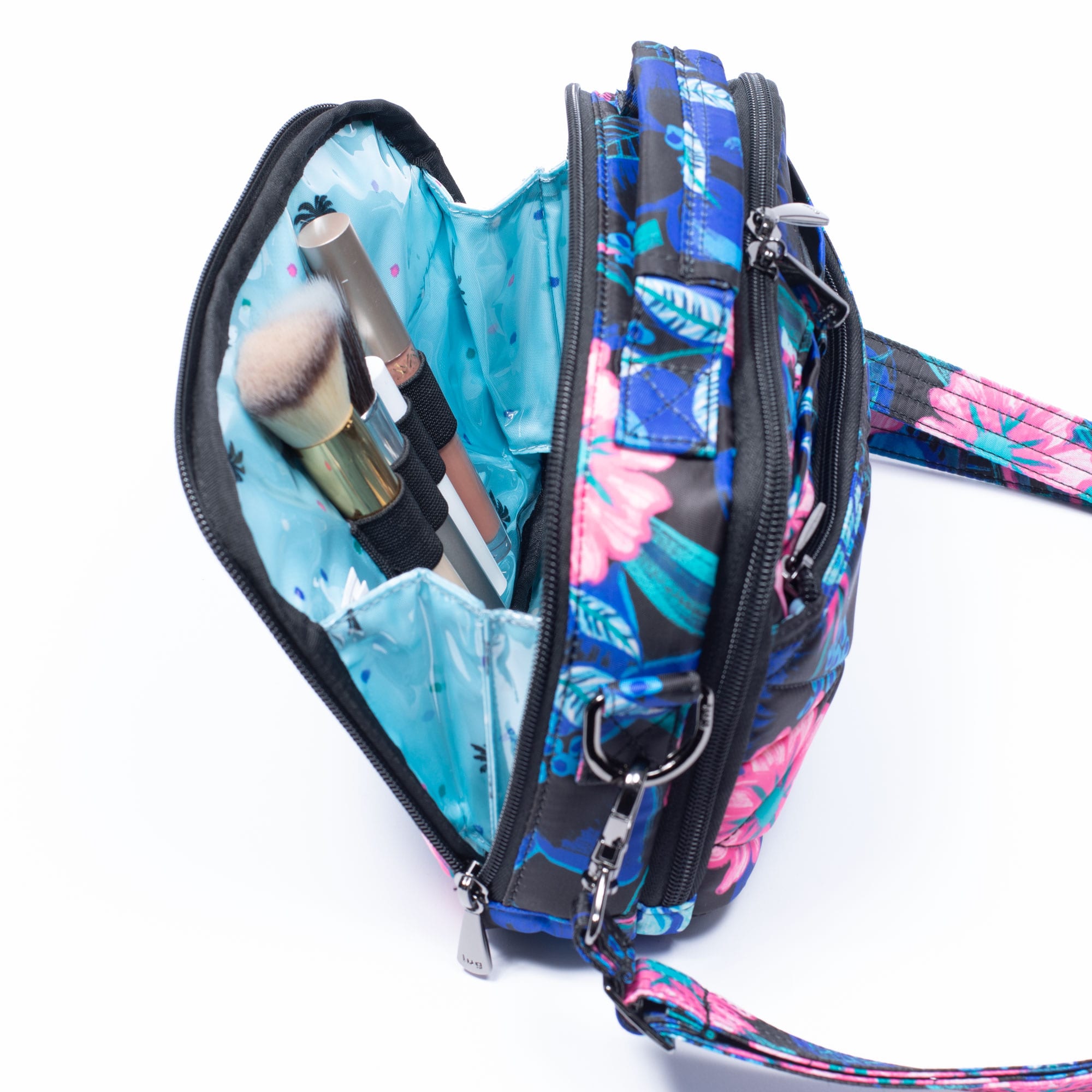 Lug Roundabout XL convertible wallet crossbody bag shown in a lifestyle setting, featuring its spacious design and adjustable strap.