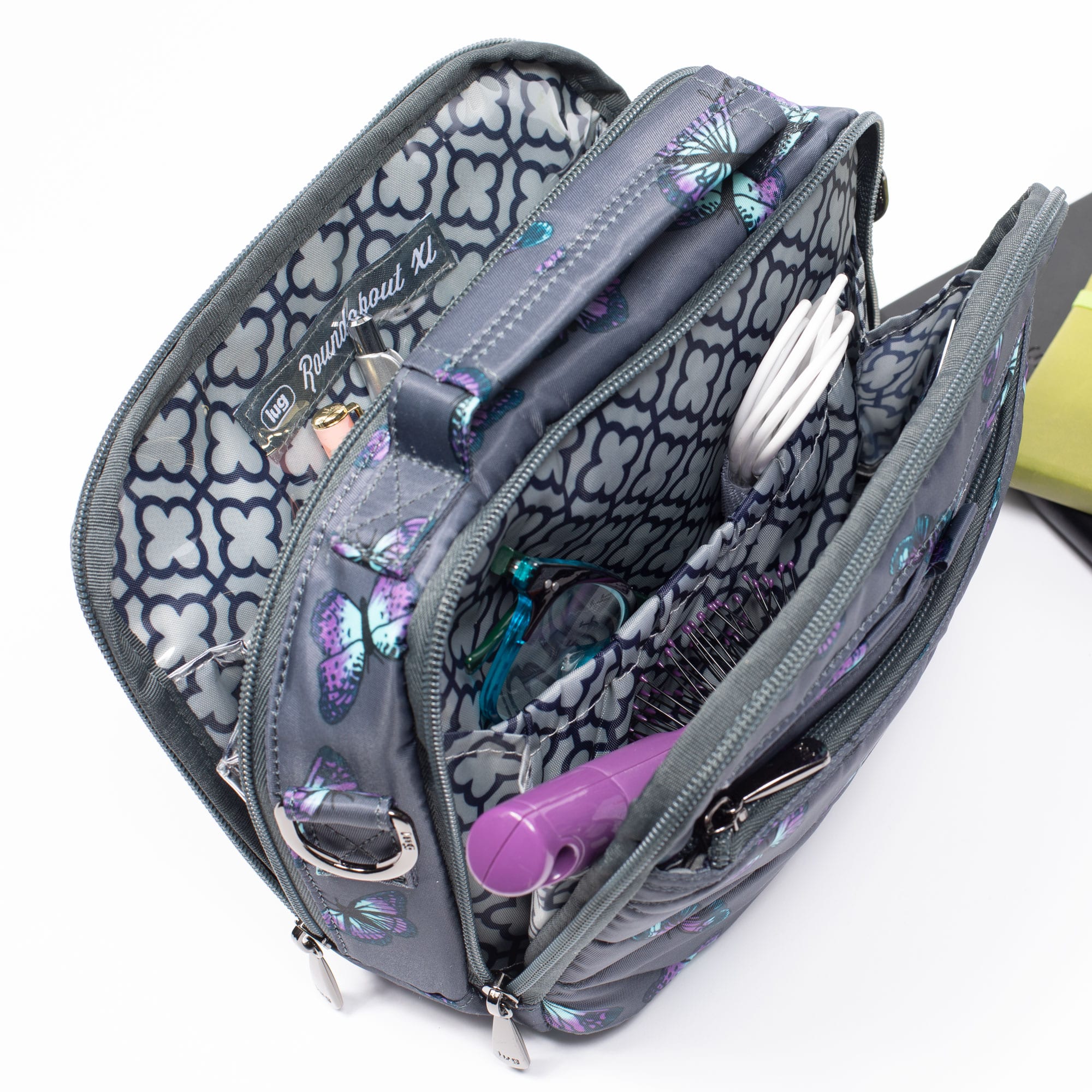 Lug Roundabout XL Convertible Wallet Crossbody bag in black leather, showing its sleek design and adjustable strap.