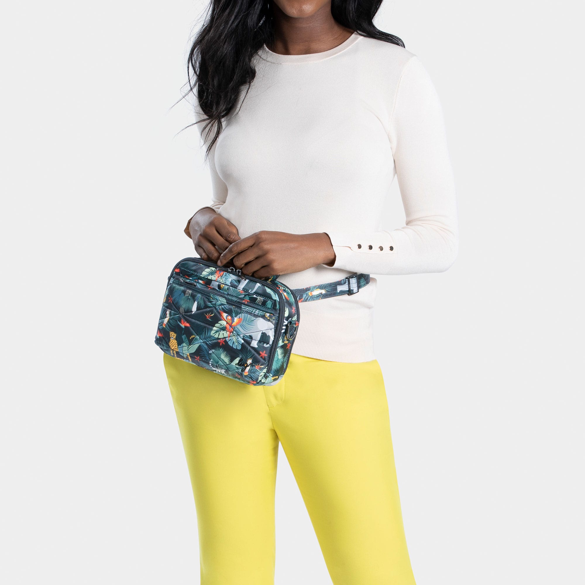 Lug Roundabout XL Convertible Wallet Crossbody bag in black with wildlife pattern and adjustable strap, stylish and versatile accessory.