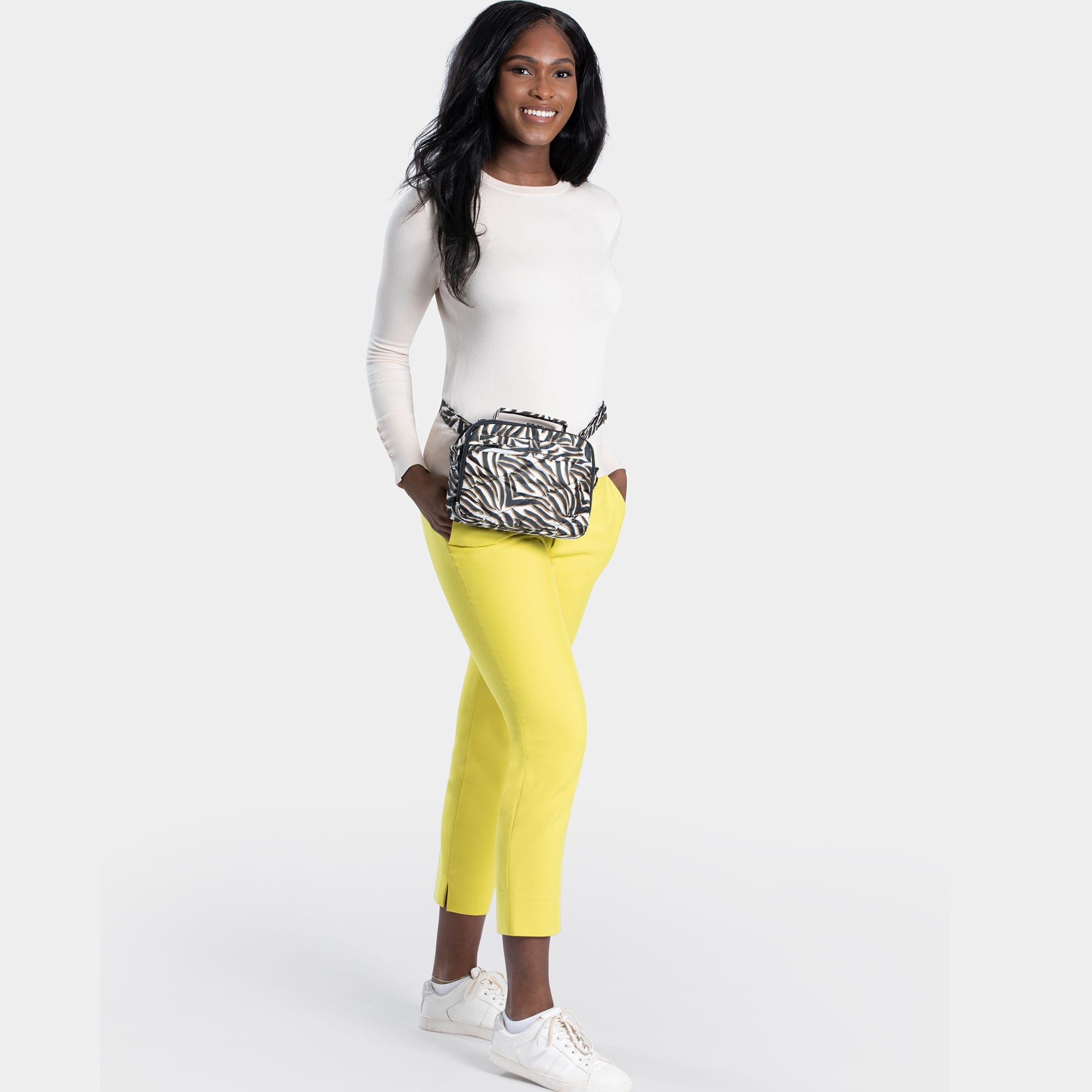 Lug Roundabout XL Convertible Wallet Crossbody in zebra pattern, showing the compact design and adjustable strap.
